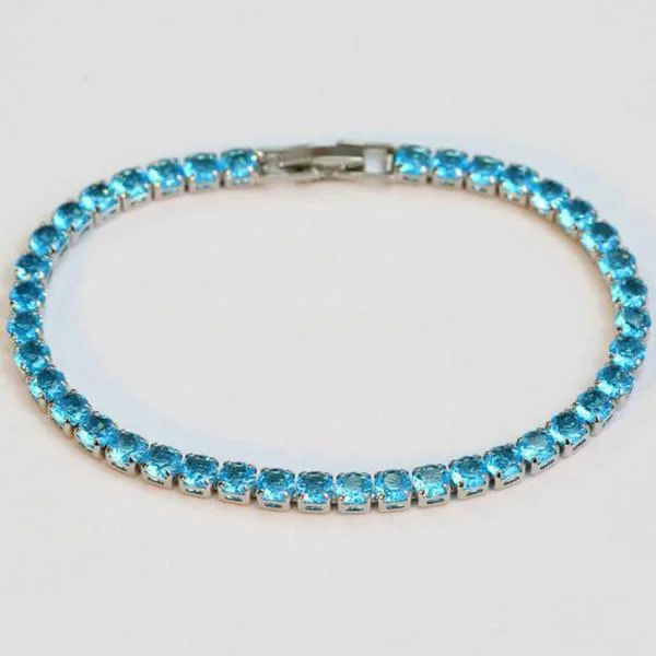 Women’s adjustable gold bracelets with gemstones-Sterling Silver Blue Aquamarine Oval Cut Petite Tennis Bracelet